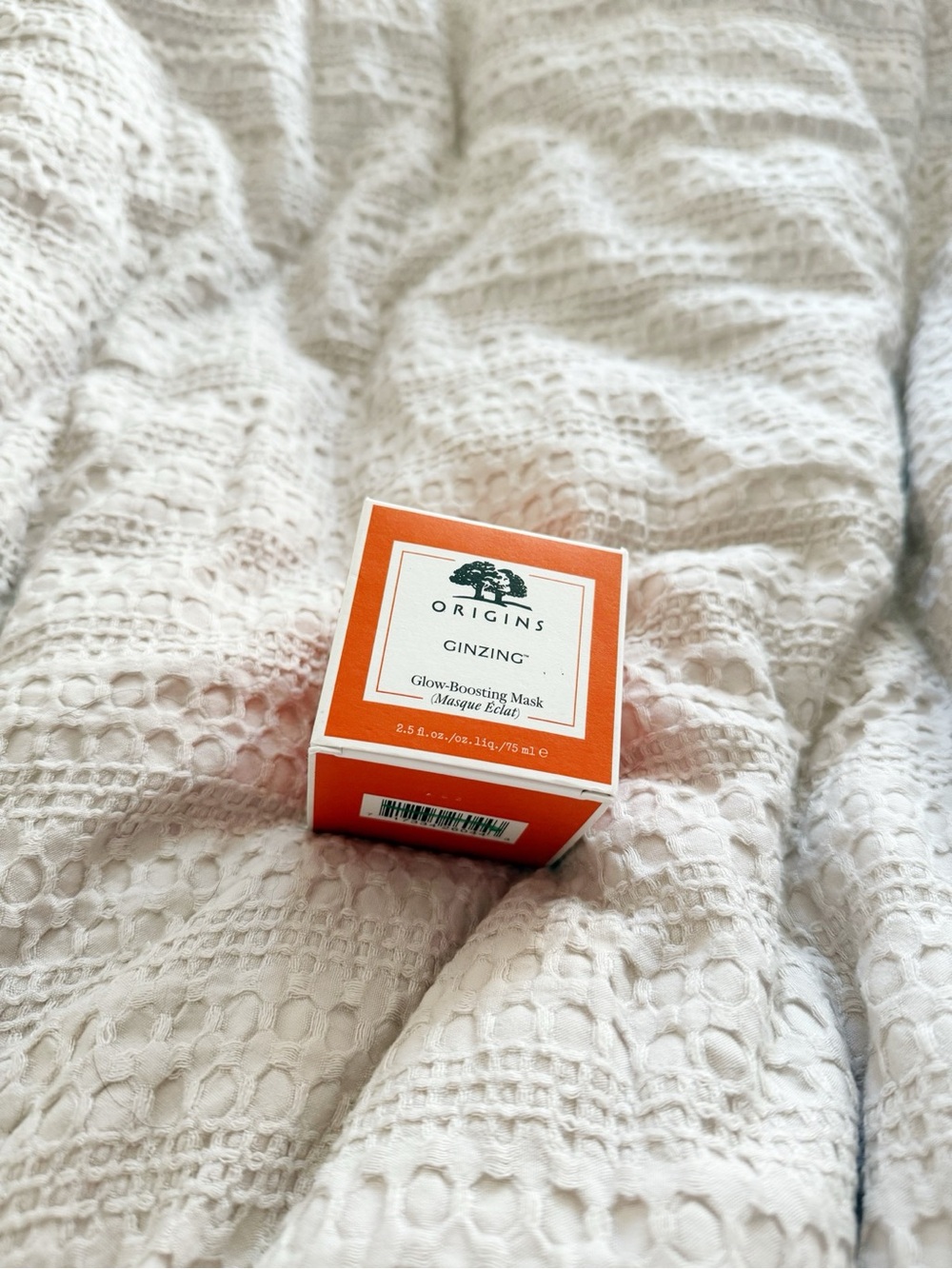 Origins GinZing Glow-Boosting Mask in bright orange box